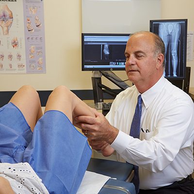 Doctor treating patient ankle